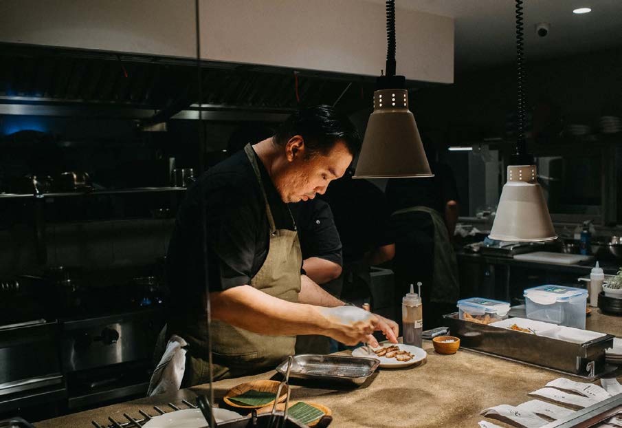 Chef Yohans preparing dishes in the YOUNG kitchen